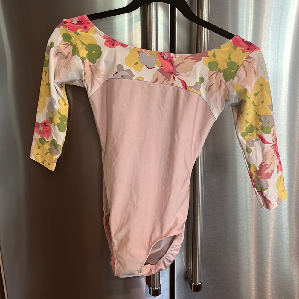 Pale pink with floral sleeve and open back
